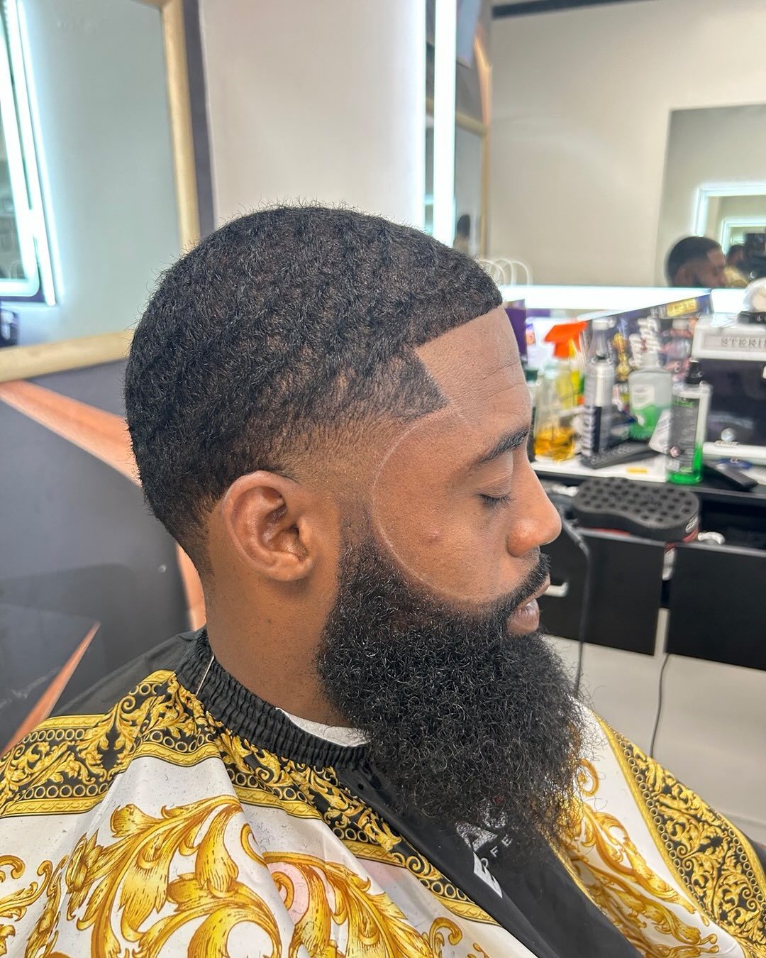 Beard grooming detail with a clean fade inside Rony's shop
